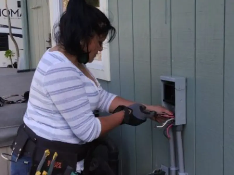 Licensed electrician wiring an exterior subpanel in Eidson Road